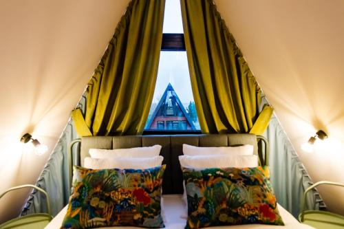 Giường trong phòng chung tại A-frame Dor De Aer