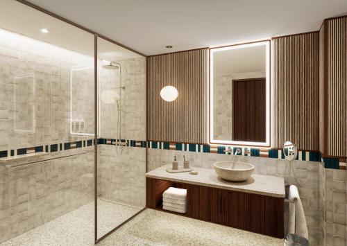 a bathroom with a sink and a shower at Vasia Resort & Spa in Sissi