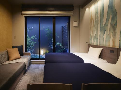 Minn Kiyomizu Gojo客房内的一张或多张床位