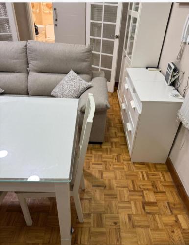 a living room with a couch and a table at Apartments soho, Malaga center in Málaga