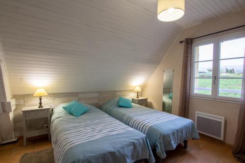 Giường trong phòng chung tại Gite des noisetiers