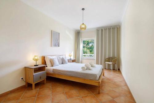 En eller flere senge i et værelse på 1H Apt Narciso