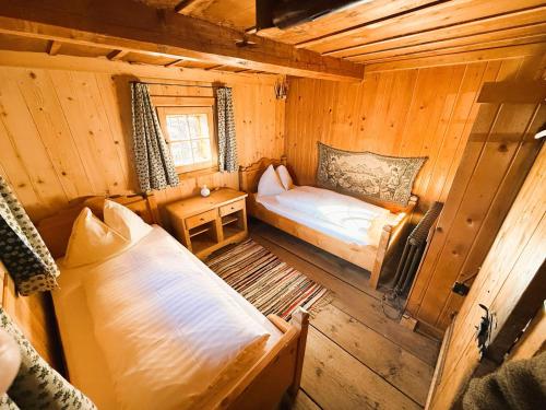 Postel nebo postele na pokoji v ubytování Chalet Wirtsalm