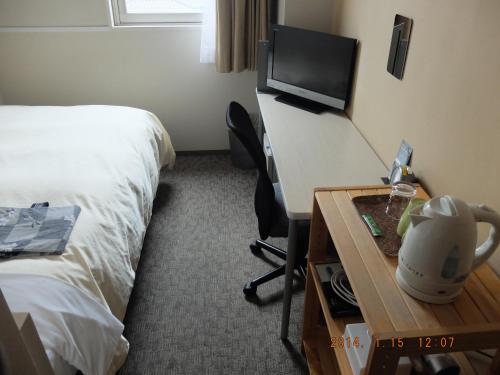 Postel nebo postele na pokoji v ubytování Hotel Crown Hills Katsuta Omotechoten