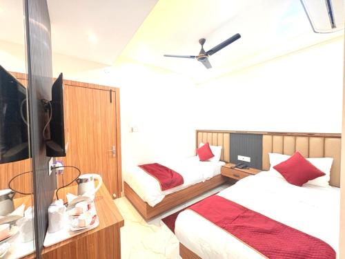 En eller flere senge i et værelse på The Gonesh Hotel