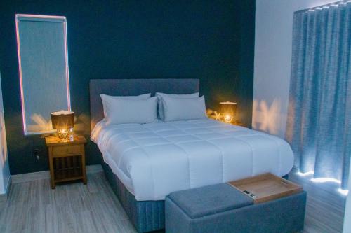 En eller flere senge i et værelse på Milino Guest House