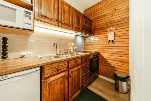 Køkken eller tekøkken på Entre Vales Refúgio Penhas da Saúde