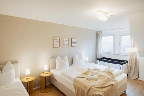 Postel nebo postele na pokoji v ubytování HYGGE HOMES - Apartment 'Lilla Lycka'