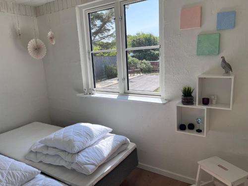 Postel nebo postele na pokoji v ubytování Newly renovated house in Gammel Skagen