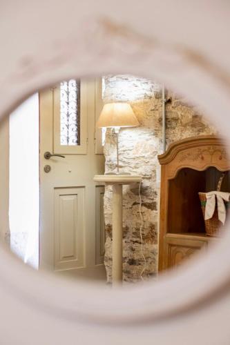 a view of a room with a door and a lamp at Hermia Mansion in Ermoupoli