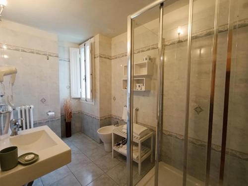 a bathroom with a glass shower and a sink at B&B A Florence View in Florence