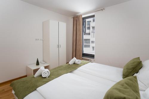 Giường trong phòng chung tại Green Apartments Bjelašnica