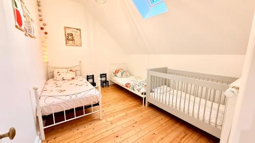 En eller flere senge i et værelse på Maison de campagne Ervytaine