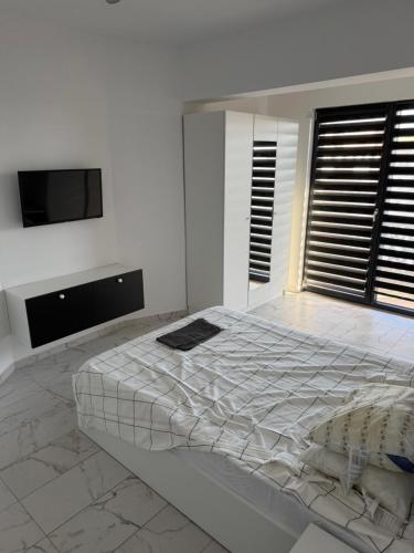 Postel nebo postele na pokoji v ubytování Bloc X4 Bulevardul Dem Radulescu