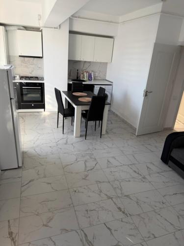 Kuchyň nebo kuchyňský kout v ubytování Bloc X4 Bulevardul Dem Radulescu