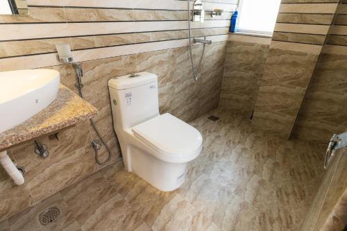 Koupelna v ubytování Maitreya Homestay