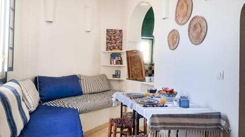 Et opholdsområde på Maison Médina, terrasse panoramique, vue mer