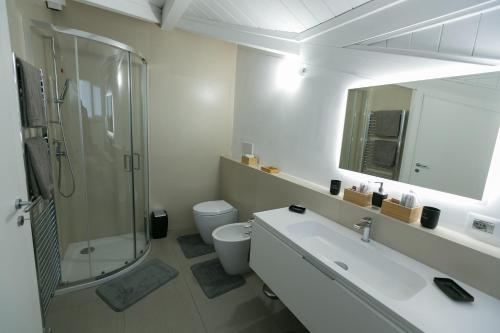a bathroom with a sink and a shower and a toilet at ALMAR HOLIDAY - Crotone in Crotone