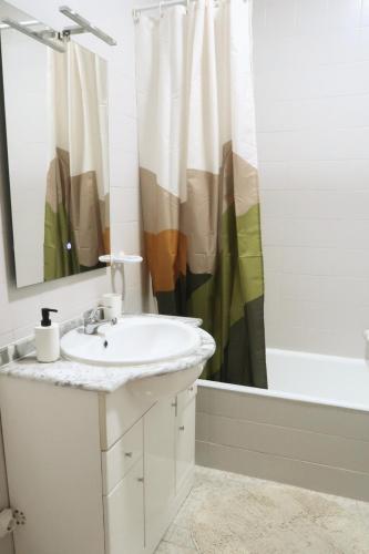 a bathroom with a sink and a shower at DaKing in Vila do Conde