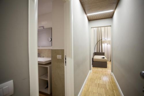 a small bathroom with a sink and a toilet at Ripetta 25 Prestige Rooms in Rome