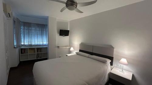 Кровать или кровати в номере Azahar Living Sevilla