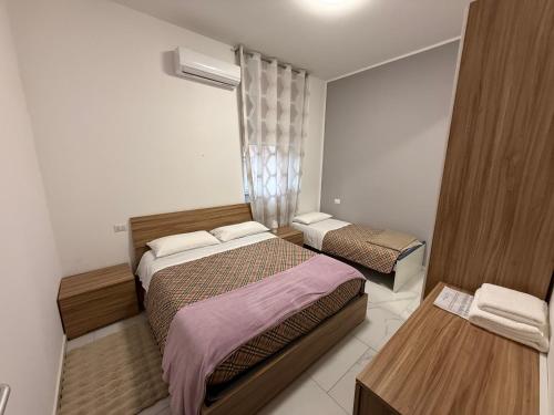 Postel nebo postele na pokoji v ubytování Era apartments posizione Milano-Bergamo-Monza