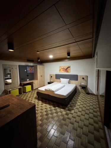 a large bedroom with a large bed in a room at EC Hotel Elchingen in Elchingen