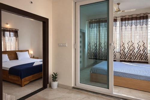 Postel nebo postele na pokoji v ubytování Vensa Homestay