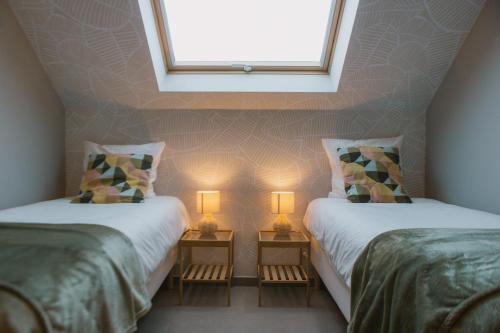 En eller flere senge i et værelse på Appartement De Pereboom