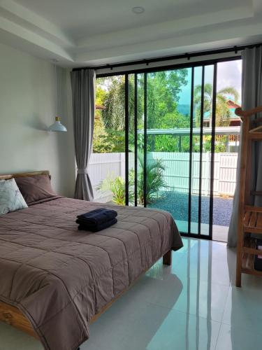 Giường trong phòng chung tại Yangyai Tree Villa