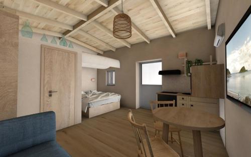 Una sala de estar con una mesa y un dormitorio. en Katoi suite, en Éxo Khóra