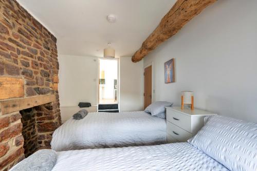 En eller flere senge i et værelse på Finest Retreats - Brecon House