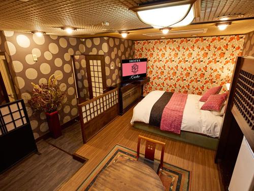 Postel nebo postele na pokoji v ubytování ホテル Liebe 岐阜