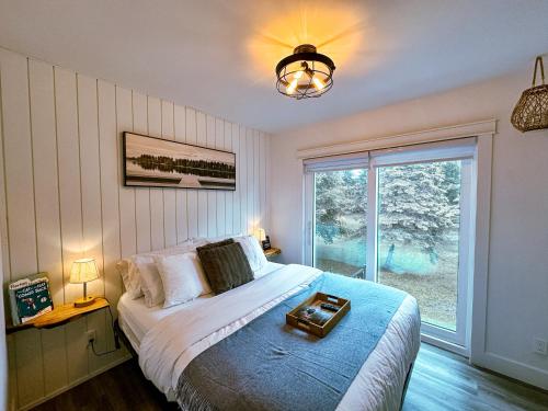 a bedroom with a bed with a tray on it at Greenview Retreat in Collingwood