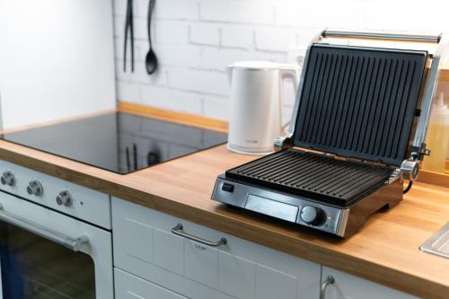 a laptop sitting on top of a counter in a kitchen at Casa 1920 Apartment in Bovec