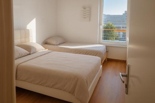 Ένα ή περισσότερα κρεβάτια σε δωμάτιο στο Bel appartement près du métro