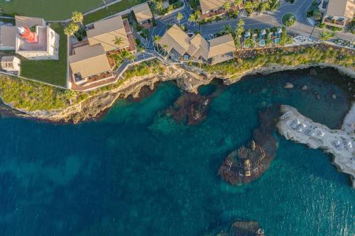 an aerial view of a resort and the ocean at Minareto in Siracusa