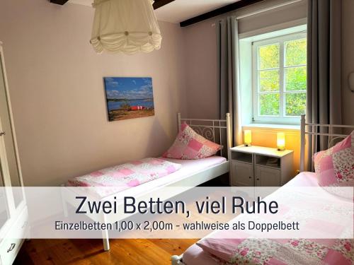 Postel nebo postele na pokoji v ubytování elbe511ferienzuhause Ruheoase im Grünen