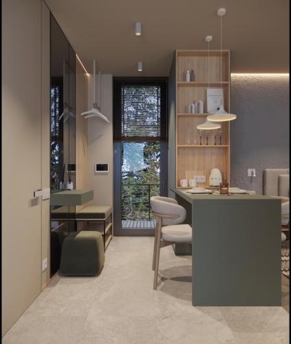 a kitchen with a counter and a table and chairs at Апартаменти Travy in Yaremche