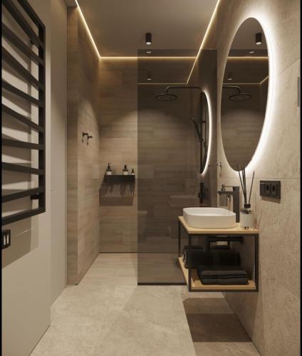 a bathroom with a sink and a mirror at Апартаменти Travy in Yaremche