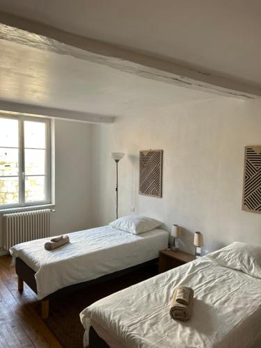 Llit o llits en una habitació de La Maison d'Ailleurs