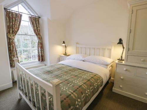 En eller flere senge i et værelse på Peniel Cottage