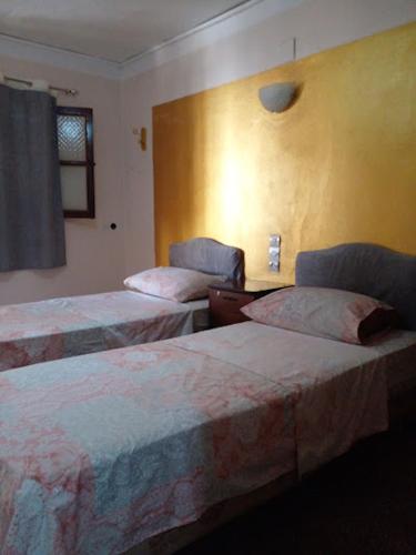 En eller flere senge i et værelse på Enjoy Ghardaia Stay