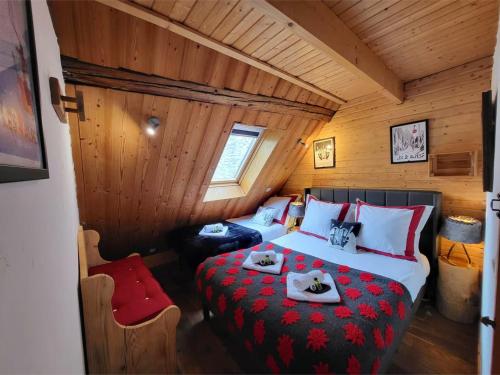En eller flere senge i et værelse på Le Cosy Lodge