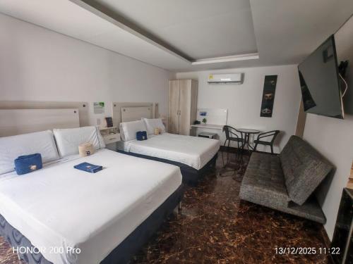 Postel nebo postele na pokoji v ubytování Hotel deluxe oasis de la colina boutique