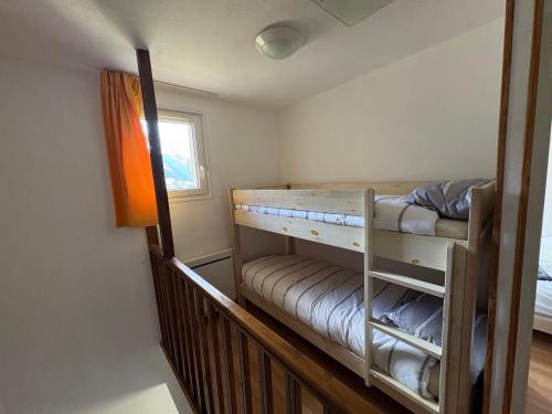 En eller flere senge i et værelse på Maison de Max