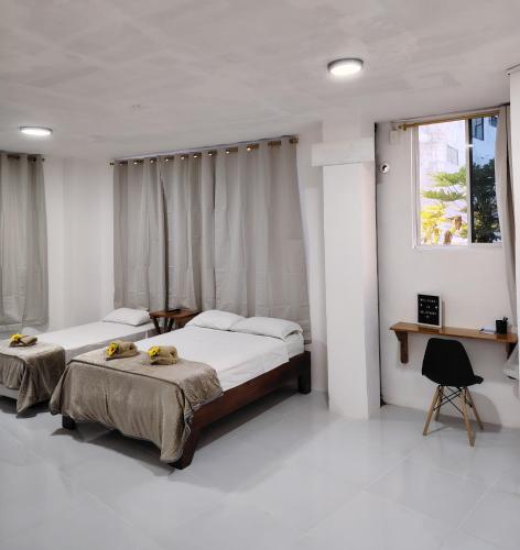 Postel nebo postele na pokoji v ubytování Darwin-Galápagos Apartment