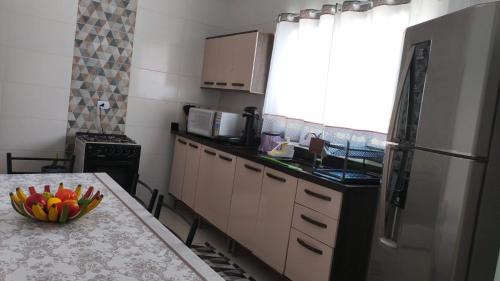 Køkken eller tekøkken på Casa com piscina climatizada em Itanhaém!