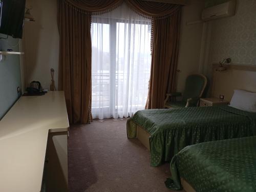 Ein Bett oder Betten in einem Zimmer der Unterkunft Hotel Majestic City Center