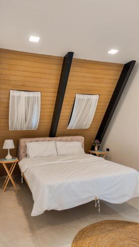 Giường trong phòng chung tại Zer House